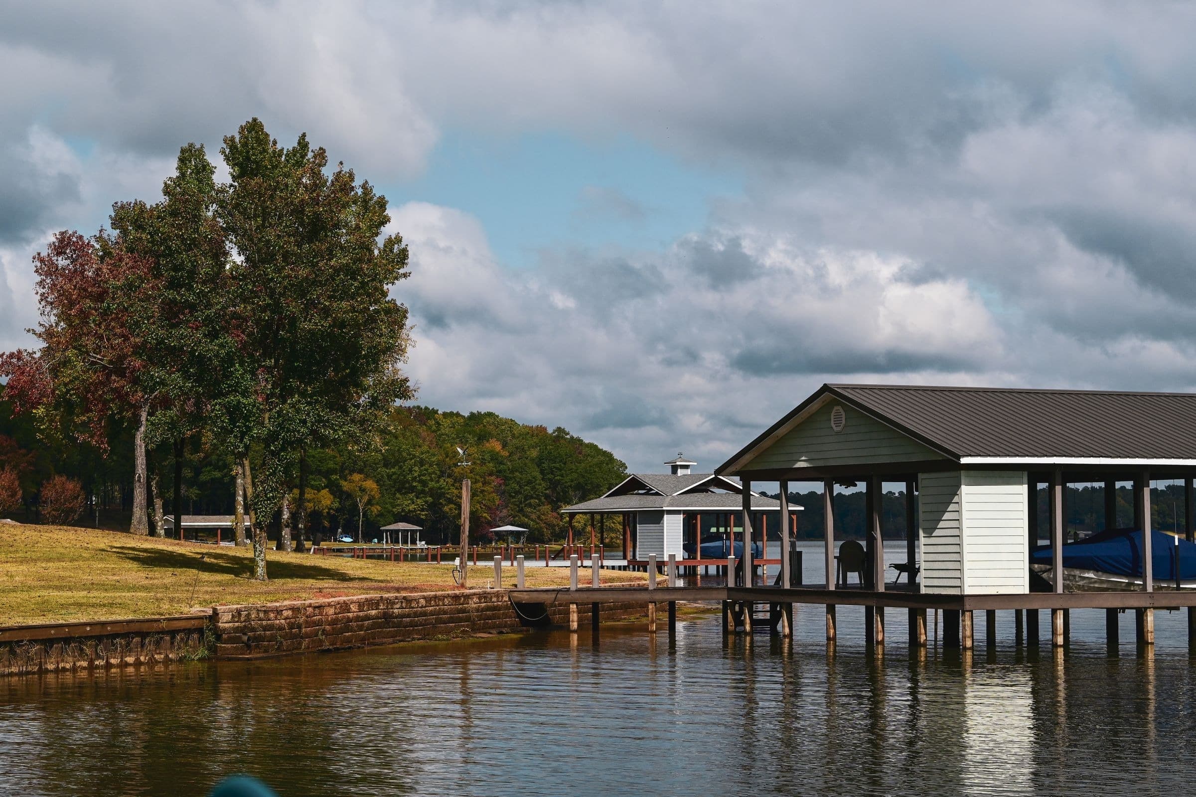 Covered boat dock and lawn on a quiet East Texas lake