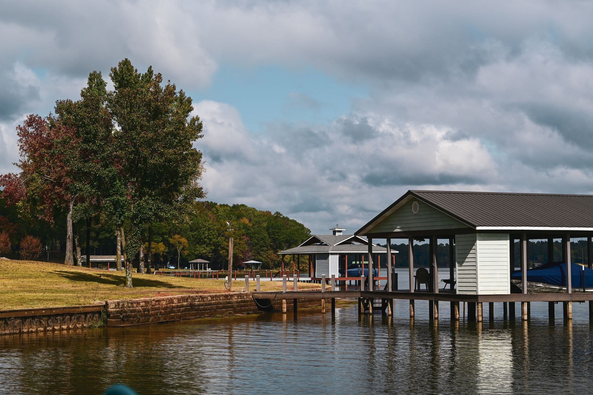 Covered boat dock and lawn on a quiet East Texas lake